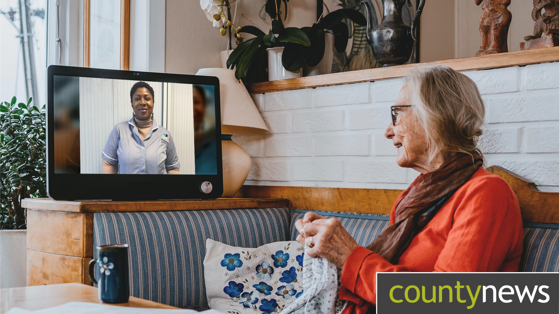 An older lady uses a webcam device