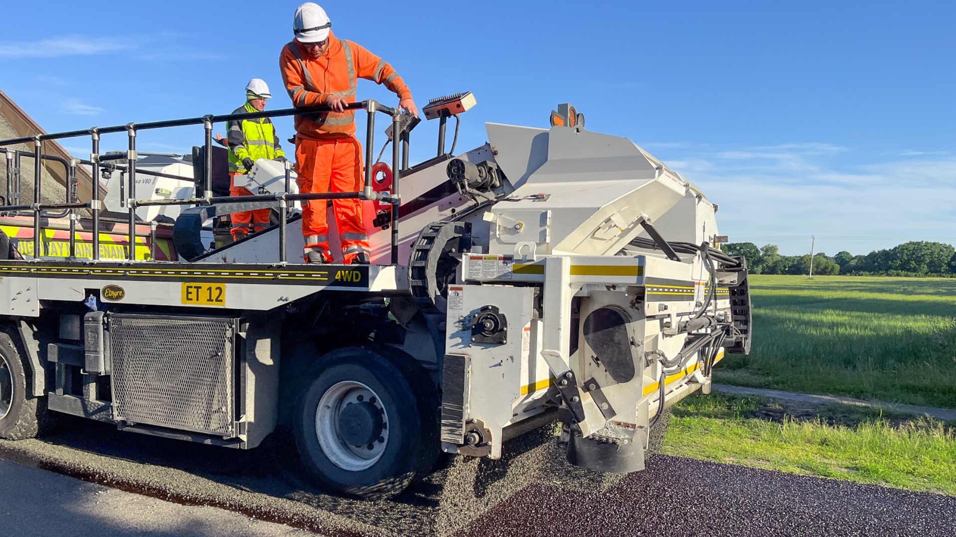 Highways officers work on a surface dressing vehicle in the county