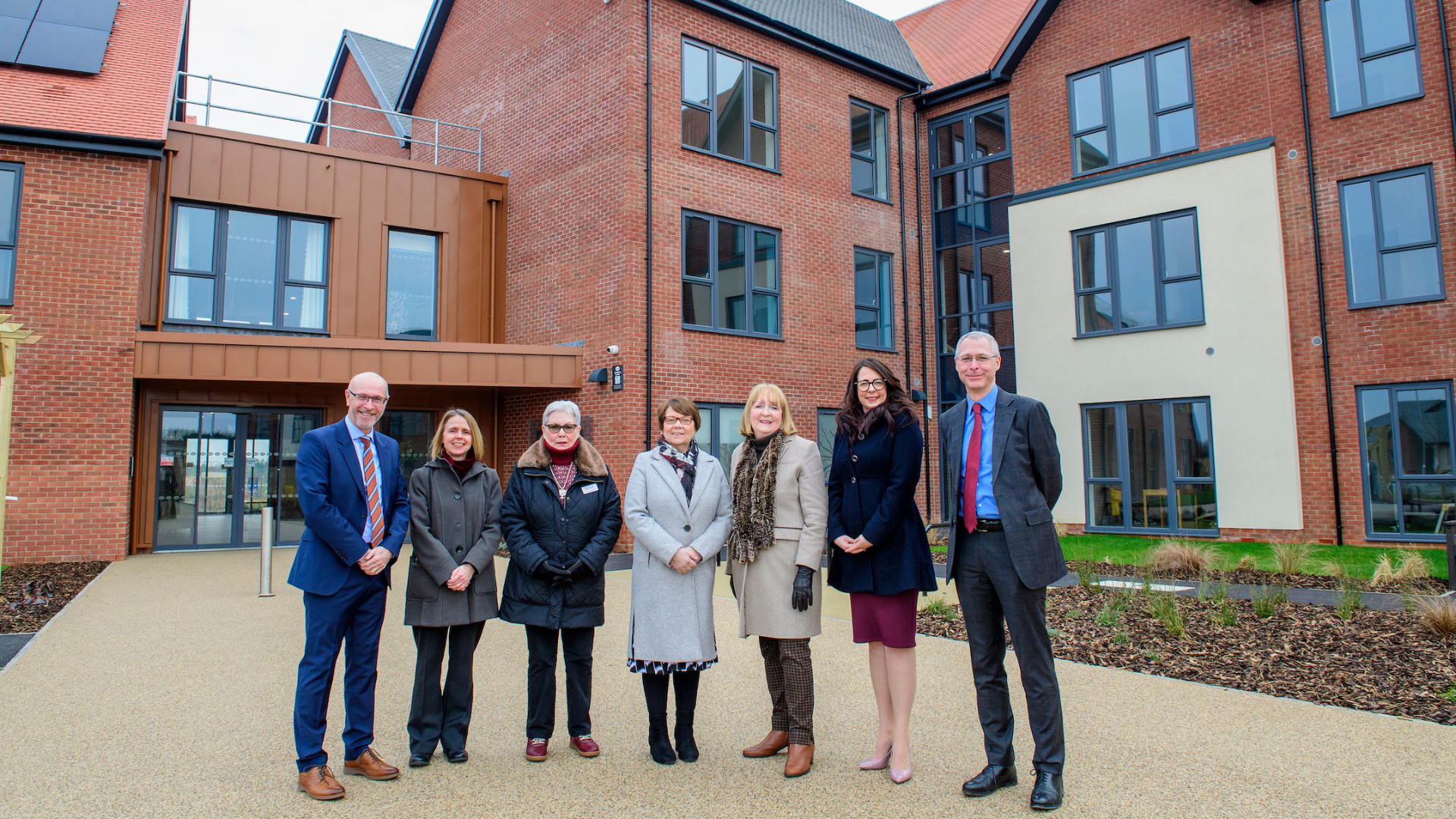 Partners outside Diamond Place extra care housing in Welton